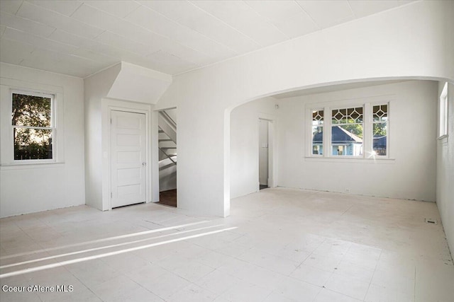 928 N 7th St, Coeur Dalene, ID 83814 - unfurnished room with plenty of natural light, arched walkways, and stairway