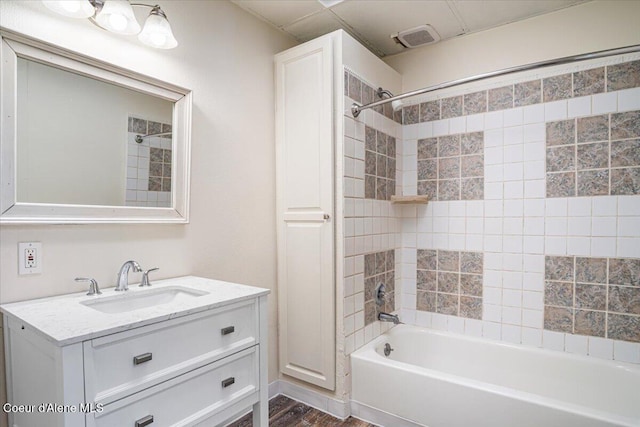 928 N 7th St, Coeur Dalene, ID 83814 - full bath featuring vanity, tub / shower combination, and wood finished floors