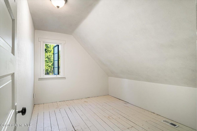 928 N 7th St, Coeur Dalene, ID 83814 - additional living space with lofted ceiling and wood-type flooring