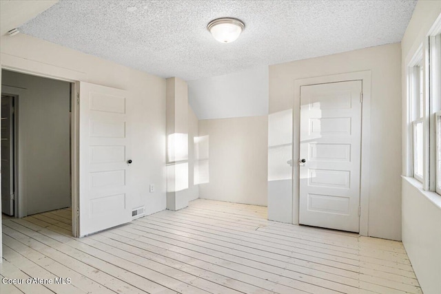 928 N 7th St, Coeur Dalene, ID 83814 - spare room with a textured ceiling and hardwood / wood-style floors