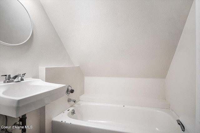 928 N 7th St, Coeur Dalene, ID 83814 - full bathroom with a bath and vaulted ceiling