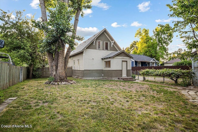 928 N 7th St, Coeur Dalene, ID 83814 - back of house featuring a fenced backyard, entry steps, and brick siding