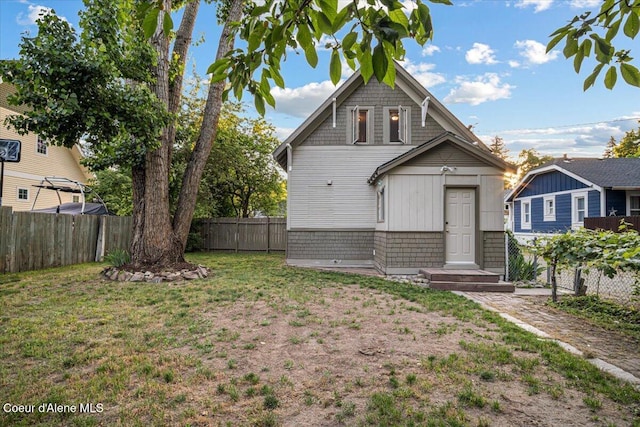 928 N 7th St, Coeur Dalene, ID 83814 - back of house featuring a fenced backyard