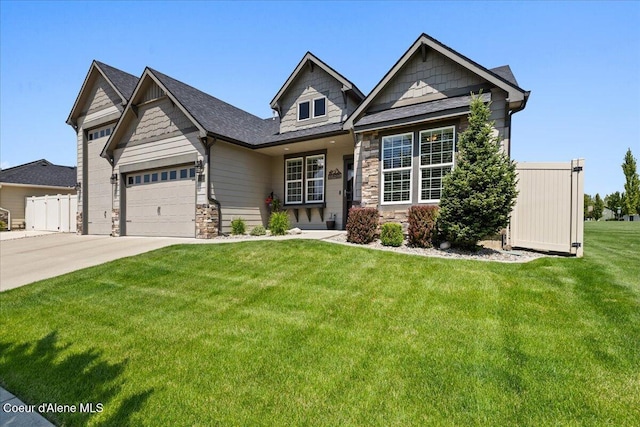 3265 E Galway Cir, Post Falls, ID 83854 - craftsman-style house with stone siding, driveway, a front yard, and a garage