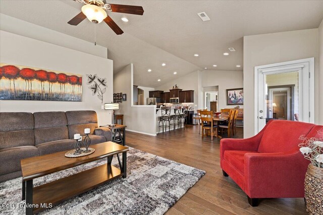 3265 E Galway Cir, Post Falls, ID 83854 - living room featuring a ceiling fan, wood finished floors, recessed lighting, and vaulted ceiling
