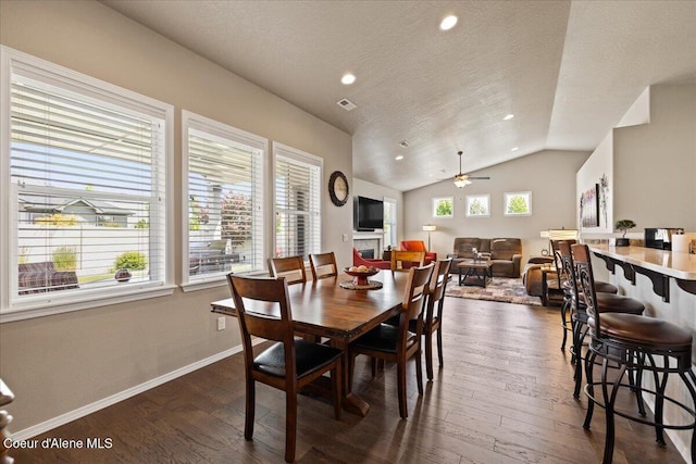 3265 E Galway Cir, Post Falls, ID 83854 - dining room featuring dark wood finished floors, lofted ceiling, recessed lighting, a textured ceiling, and a ceiling fan