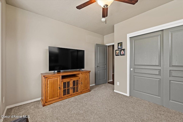 3265 E Galway Cir, Post Falls, ID 83854 - unfurnished living room featuring carpet, a ceiling fan, and a textured ceiling