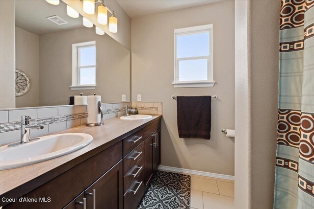 3265 E Galway Cir, Post Falls, ID 83854 - bathroom featuring double vanity and tile patterned floors