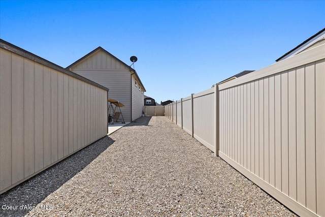 3265 E Galway Cir, Post Falls, ID 83854 - fenced backyard with a patio area