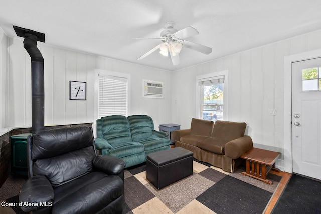 1901 E Pennsylvania Ave, Coeur Dalene, ID 83814 - living area with a wood stove, ceiling fan, and a wall mounted AC