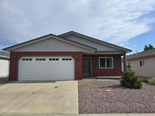 8706 W Sawtooth St, Rathdrum, ID 83858 - single story home featuring concrete driveway and a garage