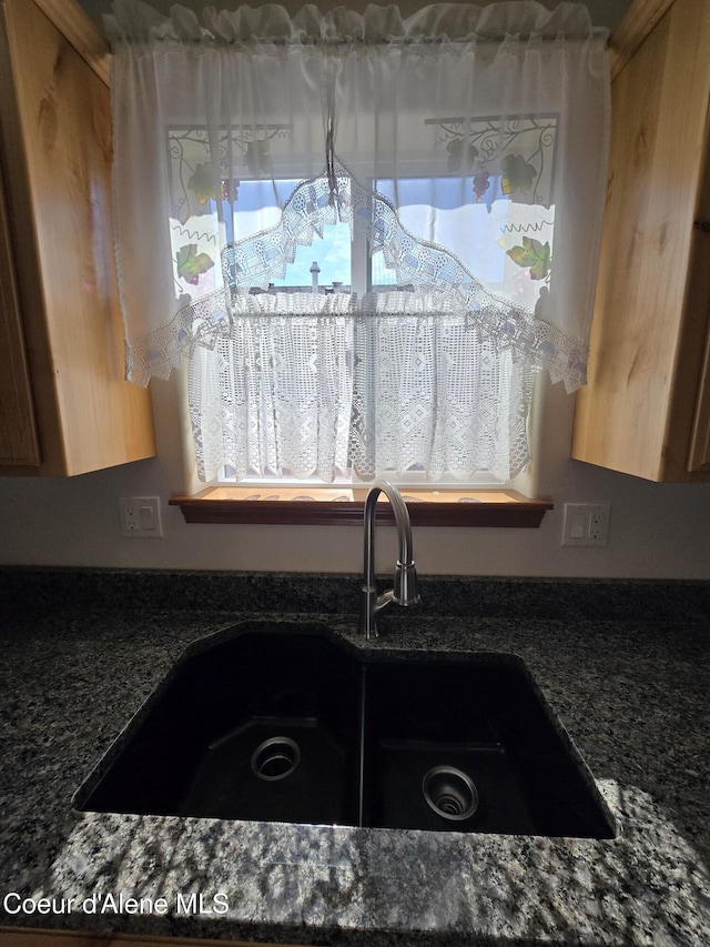8706 W Sawtooth St, Rathdrum, ID 83858 - kitchen view of a sink and dark stone counters