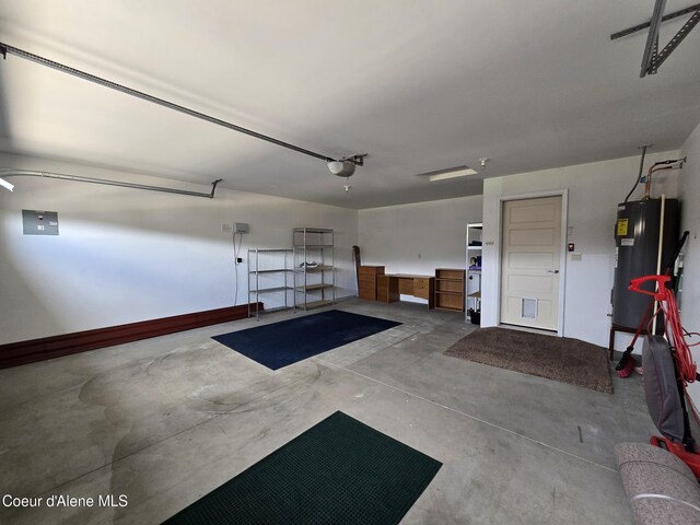 8706 W Sawtooth St, Rathdrum, ID 83858 - garage featuring water heater and a garage door opener