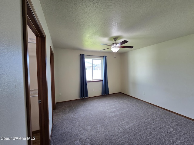 8706 W Sawtooth St, Rathdrum, ID 83858 - empty room with ceiling fan, carpet, and a textured ceiling
