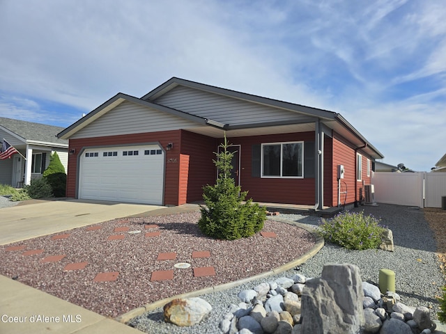8706 W Sawtooth St, Rathdrum, ID 83858 - view of front of house featuring a garage and concrete driveway