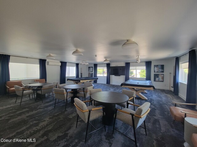 8706 W Sawtooth St, Rathdrum, ID 83858 - dining area featuring carpet floors and a wall mounted air conditioner