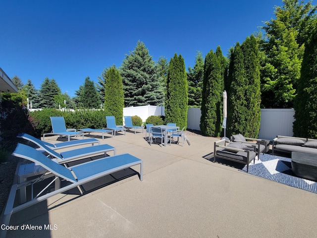 8706 W Sawtooth St, Rathdrum, ID 83858 - view of patio / terrace with an outdoor living space and outdoor dining area