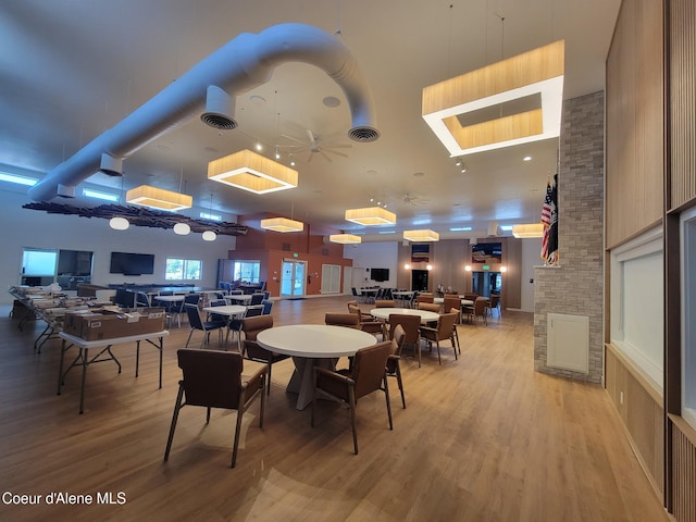 8706 W Sawtooth St, Rathdrum, ID 83858 - dining room with light wood-style floors and a towering ceiling