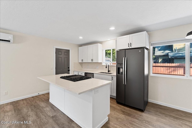 1038 N 15th St, Coeur Dalene, ID 83814 - kitchen with stainless steel fridge with ice dispenser, a center island, white cabinetry, wood finished floors, and dishwashing machine