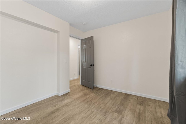 1038 N 15th St, Coeur Dalene, ID 83814 - unfurnished bedroom with light wood-type flooring