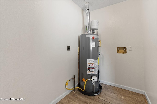 1038 N 15th St, Coeur Dalene, ID 83814 - utility room with gas water heater