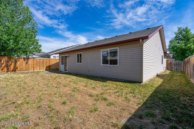 2533 W Grenoble Ln, Coeur Dalene, ID 83815 - back of house with a fenced backyard