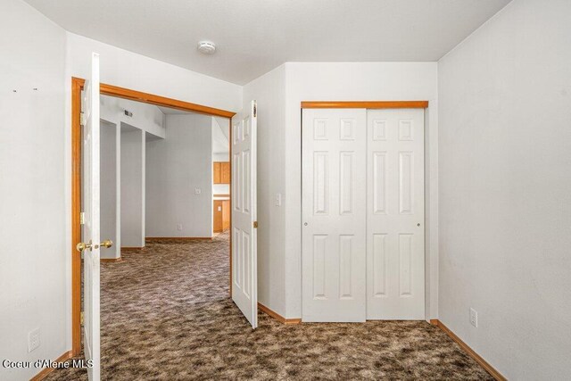 2533 W Grenoble Ln, Coeur Dalene, ID 83815 - unfurnished bedroom featuring carpet and a closet