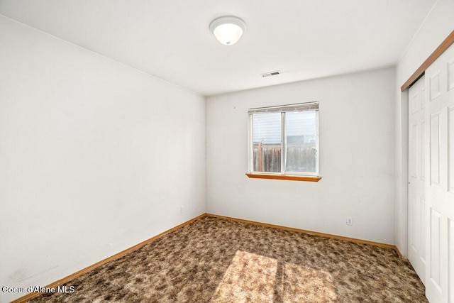 2533 W Grenoble Ln, Coeur Dalene, ID 83815 - unfurnished bedroom with a closet and carpet floors