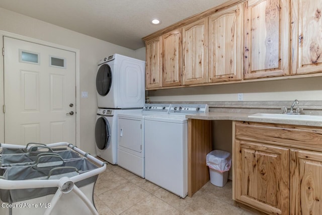 6531 Tannenbaum Cir, Bonners Ferry, ID 83805 - washroom featuring cabinet space, light tile patterned floors, estacked washer and dryer, and recessed lighting