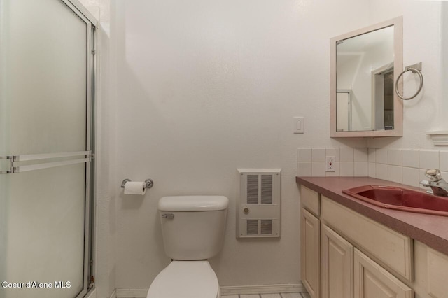 6531 Tannenbaum Cir, Bonners Ferry, ID 83805 - bathroom with vanity, a shower stall, backsplash, and heating unit