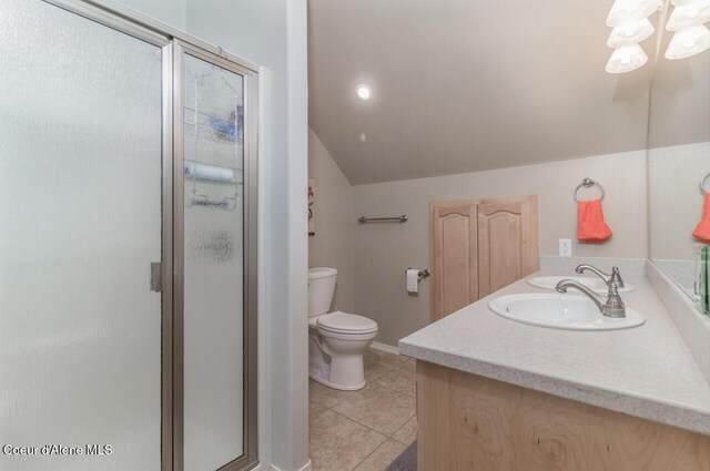 6531 Tannenbaum Cir, Bonners Ferry, ID 83805 - bathroom with lofted ceiling, a shower stall, tile patterned floors, and double vanity