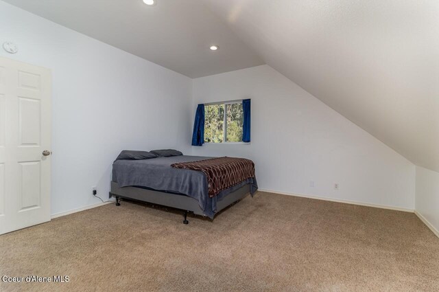 6531 Tannenbaum Cir, Bonners Ferry, ID 83805 - bedroom with carpet, vaulted ceiling, and recessed lighting