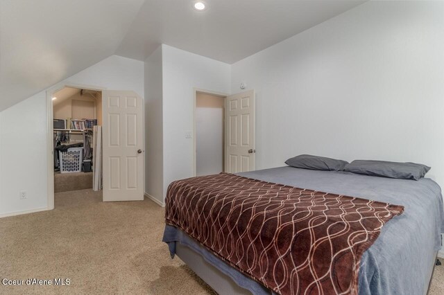 6531 Tannenbaum Cir, Bonners Ferry, ID 83805 - bedroom featuring carpet flooring, lofted ceiling, and recessed lighting