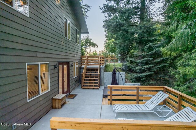 6531 Tannenbaum Cir, Bonners Ferry, ID 83805 - deck featuring stairway and a patio