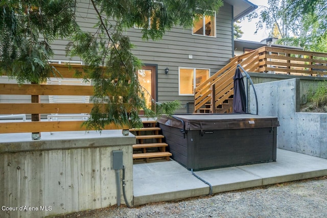 6531 Tannenbaum Cir, Bonners Ferry, ID 83805 - view of patio with a hot tub, stairway, and a wooden deck