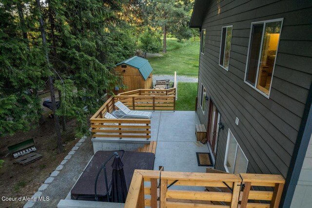 6531 Tannenbaum Cir, Bonners Ferry, ID 83805 - view of patio / terrace featuring a storage shed, a wooden deck, and outdoor dining area