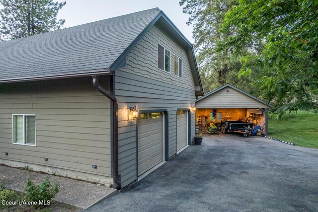 6531 Tannenbaum Cir, Bonners Ferry, ID 83805 - view of side of property featuring a shingled roof