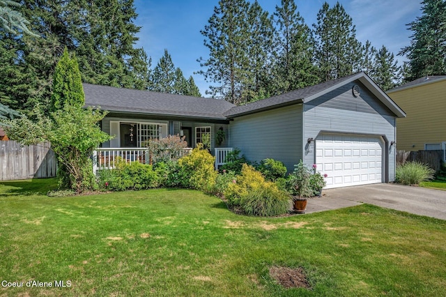 8562 N Audubon Dr, Hayden, ID 83835 - view of front of property featuring a garage, driveway, and a shingled roof