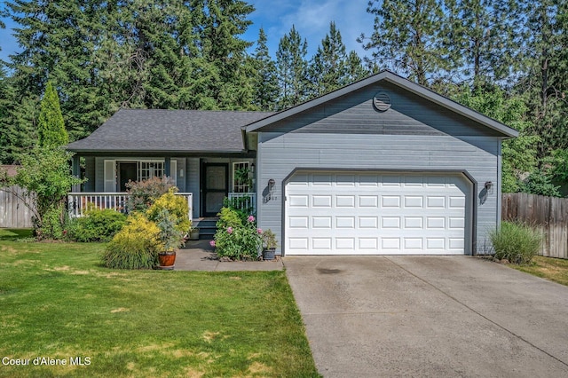8562 N Audubon Dr, Hayden, ID 83835 - ranch-style house featuring driveway, an attached garage, and covered porch