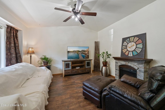 8562 N Audubon Dr, Hayden, ID 83835 - living room with hardwood / wood-style floors, lofted ceiling, a ceiling fan, and a stone fireplace