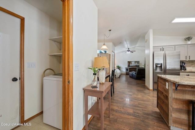 8562 N Audubon Dr, Hayden, ID 83835 - laundry room with washer / dryer, a ceiling fan, and dark wood finished floors
