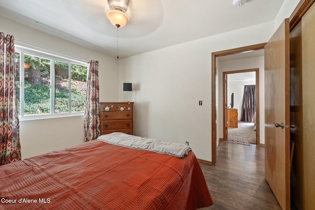 8562 N Audubon Dr, Hayden, ID 83835 - bedroom with dark wood finished floors and a ceiling fan