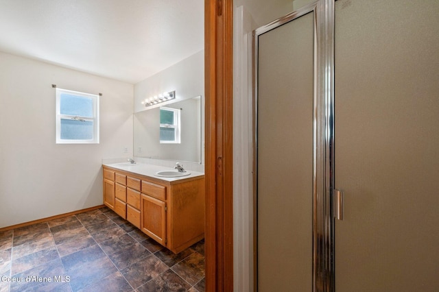 8562 N Audubon Dr, Hayden, ID 83835 - full bathroom featuring a shower stall, double vanity, and stone finish floors