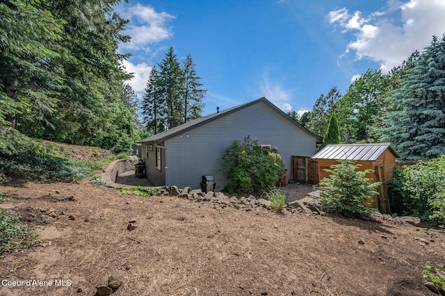 8562 N Audubon Dr, Hayden, ID 83835 - view of side of home with a shed