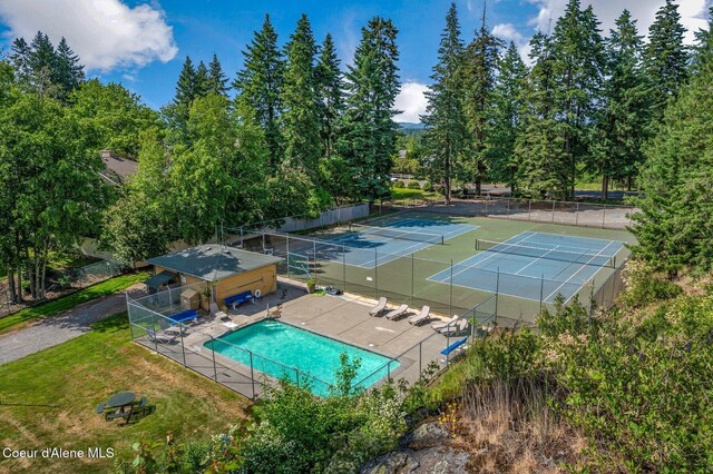 8562 N Audubon Dr, Hayden, ID 83835 - view of tennis court featuring a community pool