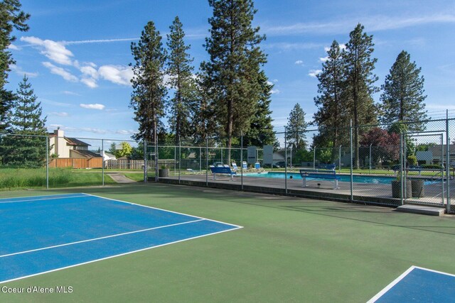 8562 N Audubon Dr, Hayden, ID 83835 - view of tennis court featuring a community pool