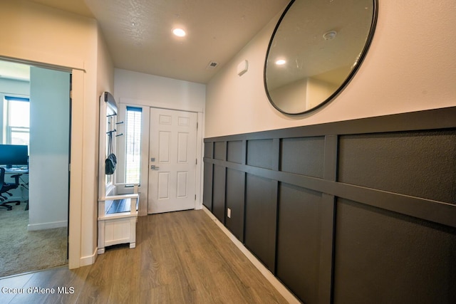 5987 W Quinn Way, Rathdrum, ID 83858 - hall featuring wood finished floors, healthy amount of natural light, and a wainscoted wall