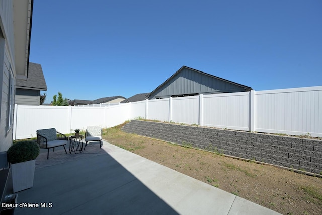 5987 W Quinn Way, Rathdrum, ID 83858 - fenced backyard with a patio