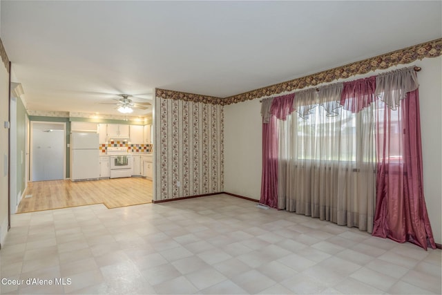 1502 N Melrose St, Coeur Dalene, ID 83814 - unfurnished living room with light floors and a ceiling fan