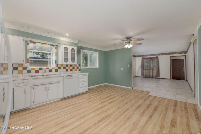 1502 N Melrose St, Coeur Dalene, ID 83814 - bar area featuring white dishwasher, ceiling fan, tasteful backsplash, and light wood-style flooring
